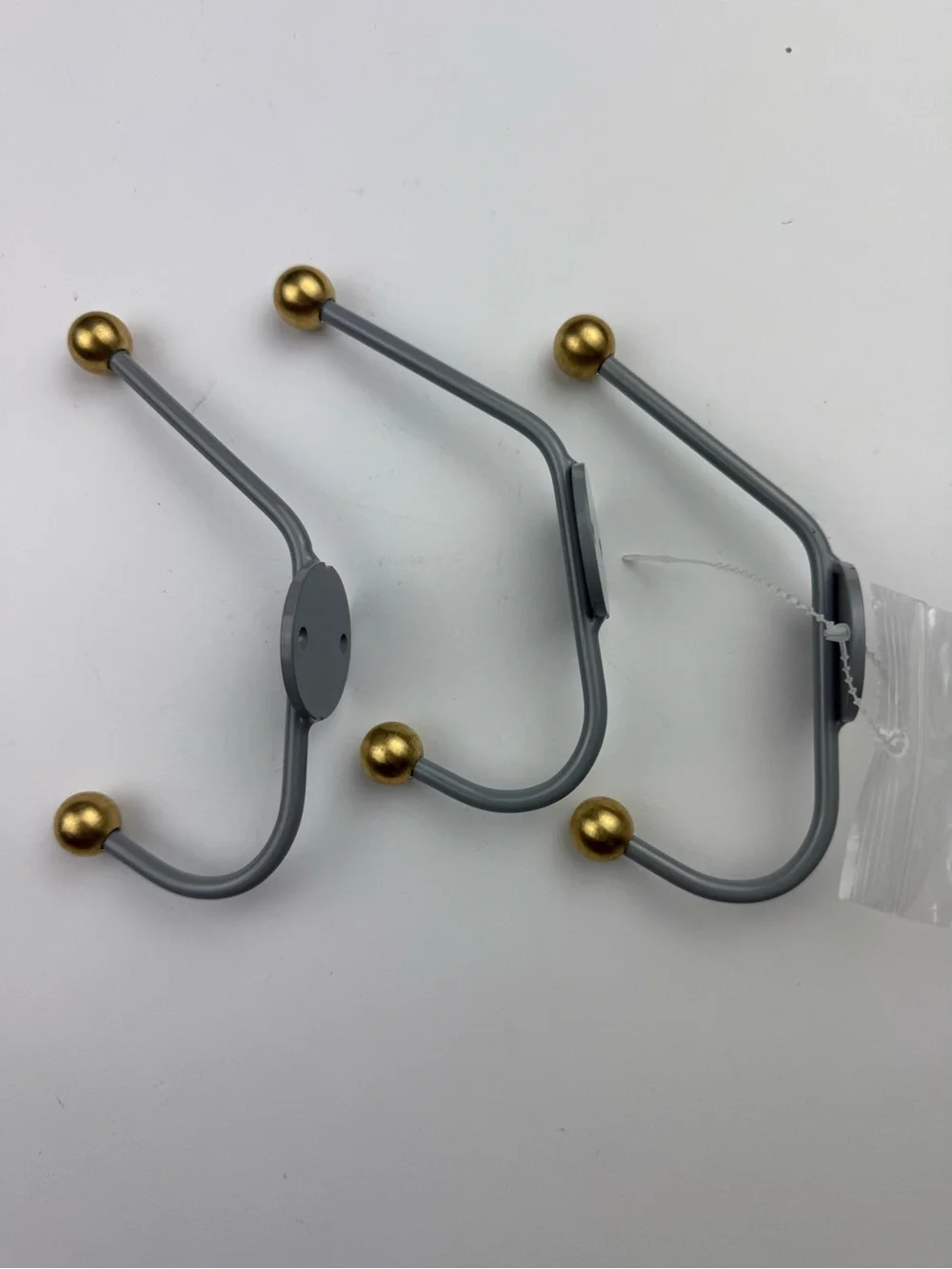 3 West Elm MCM coat hooks - gray with gold balls